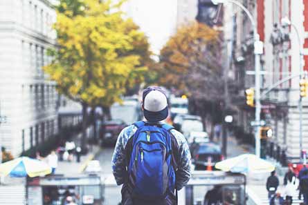 A person is starting out at a city with their back to the camera